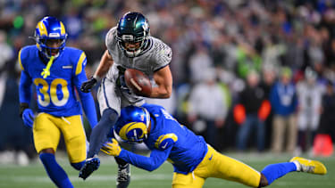 Los Angeles Rams safety Kam Curl (3) forces a fumble against Seattle Seahawks wide receiver Cooper Kupp (10)