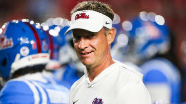 Nov 15, 2025; Oxford, Mississippi, USA; Mississippi Rebels head coach Lane Kiffin watches pregame warmups against the Florida Gators at Vaught-Hemingway Stadium. Mandatory Credit: Petre Thomas-Imagn Images