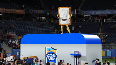 Dec 28, 2024; Orlando, FL, USA; The Cinnamon Pop-Tart mascot stands on top of a toaster to be toasted after the Iowa State Cyclones defeatied the Miami Hurricanes at Camping World Stadium. Mandatory Credit: Jasen Vinlove-Imagn Images