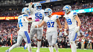 Detroit Lions tight end Sam LaPorta (87) celebrates a touchdown against Arizona Cardinals with wide receiver Amon-Ra St. Brown (14), offensive tackle Penei Sewell (58) and tight end Brock Wright (89) during the first half at State Farm Stadium in Glendale, Arizona on Sunday, Oct. 11, 2026.