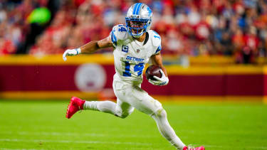 Detroit Lions wide receiver Amon-Ra St. Brown (14) runs with the ball