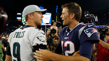 New England Patriots quarterback Tom Brady (12) meets Philadelphia Eagles quarterback Nick Foles (9) after the game at Gillette Stadium.