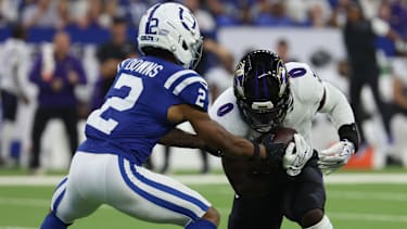 Indianapolis Colts Wide Receiver Josh Downs (2) tacklet Baltimore Ravens Linebacker Roquan Smith.