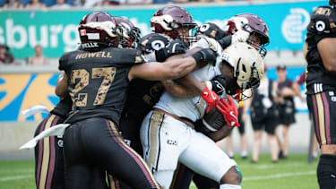 Rhein Fire tries to get the ball from Berlin Thunder.