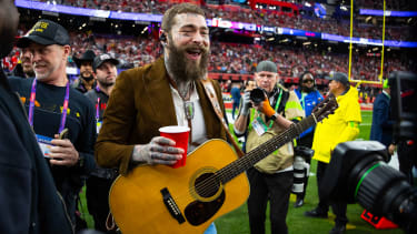 Feb 11, 2024; Paradise, Nevada, USA; Recording artist Post Malone walks on the field before Super Bowl LVIII between the San Francisco 49ers and the Kansas City Chiefs at Allegiant Stadium. Mandatory Credit: Mark J. Rebilas-Imagn Images