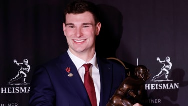 Indiana Quarterback Fernando Mendoza holds the Heisman Trophy