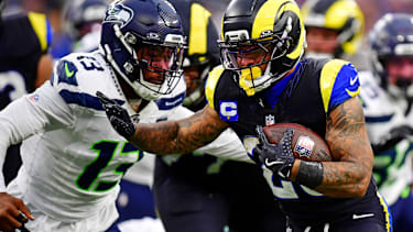 Nov 16, 2025; Inglewood, California, USA; Los Angeles Rams running back Kyren Williams (23) against Seattle Seahawks linebacker Ernest Jones IV (13) during the second half at SoFi Stadium. Mandatory Credit: Gary A. Vasquez-Imagn Images
