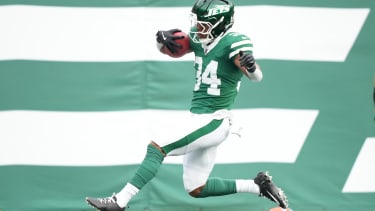Nov 9, 2025; East Rutherford, New Jersey, USA;  New York Jets running back Kene Nwangwu (34) scores a first quarter touchdown on a kickoff return against Cleveland Browns Cleveland Browns cornerback Tre Avery (28) and the Cleveland Browns at MetLife Stadium. Mandatory Credit: Robert Deutsch-Imagn Images