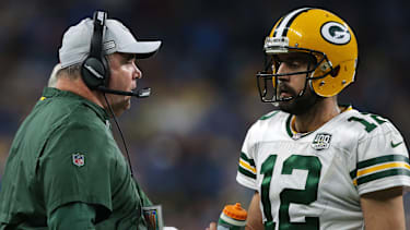 Green Bay Packers head coach Mike McCarthy talks to quarterback Aaron Rodgers (12) during the second half of an NFL