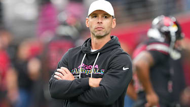 Arizona Cardinals head coach Jonathan Gannon stands on the field
