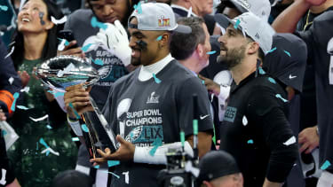 NEW ORLEANS, LOUISIANA - FEBRUARY 09: Jalen Hurts #1 of the Philadelphia Eagles and Head coach Nick Sirianni celebrates with the Vince Lombardi Trophy after defeating the Kansas City Chiefs 40-22 to win Super Bowl LIX at Caesars Superdome on February 09, 2025 in New Orleans, Louisiana. (Photo by Chris Graythen/Getty Images)