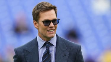 Sports announcer Tom Brady looks on before the game