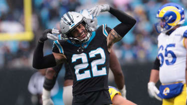 Nov 30, 2025; Charlotte, North Carolina, USA; Carolina Panthers safety Lathan Ransom (22) celebrates after a play during the third quarter against the Los Angeles Rams at Bank of America Stadium. Mandatory Credit: Scott Kinser-Imagn Images