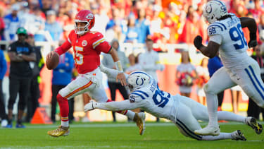 Nov 23, 2025; Kansas City, Missouri, USA; Kansas City Chiefs quarterback Patrick Mahomes (15) runs against Indianapolis Colts defensive tackle Adetomiwa Adebawore (95) in the second half at GEHA Field at Arrowhead Stadium. Mandatory Credit: Jay Biggerstaff-Imagn Images