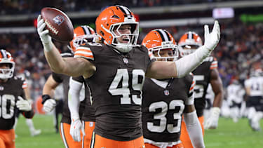 Cleveland Browns Carson Schwesinger (49) celebrates his interception in the third quarter against the Baltimore Ravens at Huntington Bank Field in Cleveland