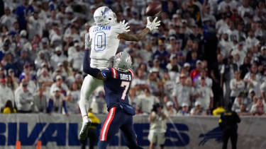 Orchard Park, New York, USA; Buffalo Bills wide receiver Keon Coleman (0) makes a catch against New England Patriots cornerback Carlton Davis III (7)