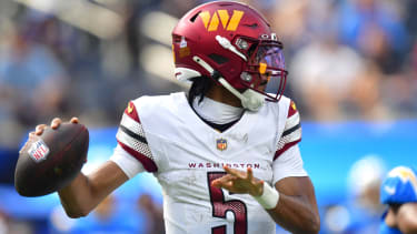 Oct 5, 2025; Inglewood, California, USA; Washington Commanders quarterback Jayden Daniels (5) throws a pass against the Los Angeles Chargers in the first half at SoFi Stadium. Mandatory Credit: Gary A. Vasquez-Imagn Images