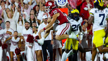 Oklahoma Sooners quarterback John Mateer (10) scores a touchdown