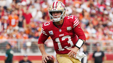 Oct 4, 2026; Santa Clara, California, USA;  San Francisco 49ers quarterback Brock Purdy (13) carries the ball against the Denver Broncos during the second half at Levi's Stadium.  Mandatory Credit: David Gonzales-Imagn Images