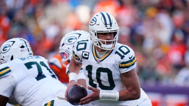 Green Bay Packers quarterback Jordan Love (10) runs in the pocket