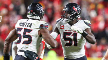 Houston Texans Will Anderson Jr. (51) and Danielle Hunter (55) celebrate a defensive stop late in the fourth quarter of an NFL