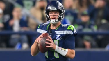 Oct 20, 2025; Seattle, Washington, USA; Seattle Seahawks quarterback Sam Darnold (14) looks to throw a pass during the first quarter against the Houston Texans at Lumen Field. Mandatory Credit: Steven Bisig-Imagn Images