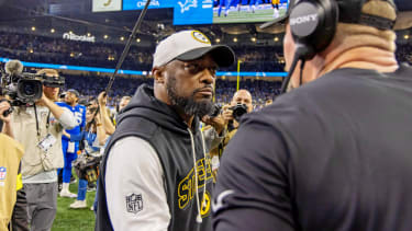Dec 21, 2025; Detroit, Michigan, USA; Pittsburgh Steelers head coach Mike Tomlin and Detroit Lions head coach Dan Campbell meet after the game at Ford Field. Mandatory Credit: David Reginek-Imagn Images