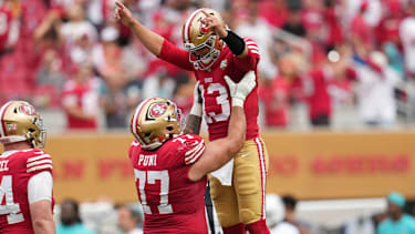 Sep 20, 2026; Santa Clara, California, USA;  San Francisco 49ers quarterback Brock Purdy (13) celebratse with offensive line Dominick Puni (77) during the third quarter against the Miami Dolphins at Levi's Stadium.  Mandatory Credit: Cary Edmondson-Imagn Images