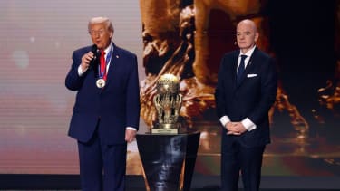 United States president Donald Trump speaks after receiving the FIFA Peace Prize from FIFA president Gianni Infantino