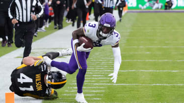 Sep 28, 2025; Dublin, Ireland; Minnesota Vikings wide receiver Jordan Addison (3) carries the ball on an 81-yard reception against Pittsburgh Steelers linebacker Payton Wilson (41) in the fourth quarter during an NFL International Series game at Croke Park. Mandatory Credit: Kirby Lee-Imagn Images