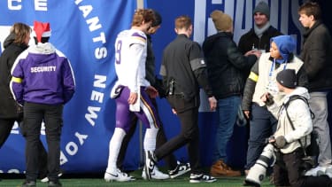 Dec 21, 2025; East Rutherford, New Jersey, USA; Minnesota Vikings quarterback J.J. McCarthy (9) is taken to the locker room after a hit against the New York Giants during the first half at MetLife Stadium. Mandatory Credit: Vincent Carchietta-Imagn Images