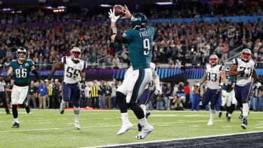 Philadelphia Eagles' Nick Foles catches a touchdown pass during the first half of the NFL Super Bowl 52 football game against the New England Patriots