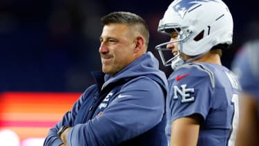 Foxborough, MA - November 13: New England Patriots head coach Mike Vrabel and quarterback Drake Maye talk during warmups. The Patriots played the New York Jets at Gillette Stadium on November 13, 2025. (Photo by Danielle Parhizkaran/The Boston Globe via Getty Images)
