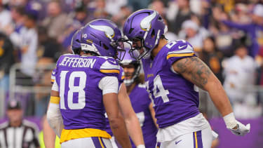 Dec 7, 2025; Minneapolis, Minnesota, USA; Minnesota Vikings tight end Josh Oliver (84) reacts after a touchdown against the Washington Commanders during the first half at U.S. Bank Stadium. Mandatory Credit: Brad Rempel-Imagn Images