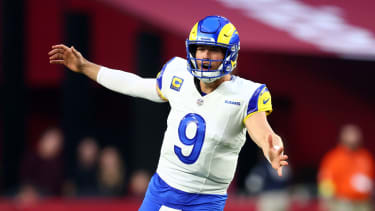 Dec 7, 2025; Glendale, Arizona, USA; Los Angeles Rams quarterback Matthew Stafford (9) reacts against the Arizona Cardinals during the second half at State Farm Stadium. Mandatory Credit: Mark J. Rebilas-Imagn Images