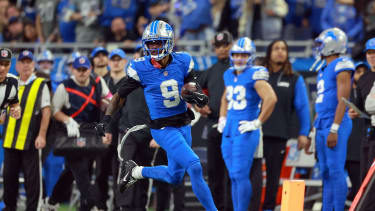 Wide receiver Jameson Williams (9) of the Detroit Lions runs the ball