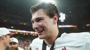 Dec 6, 2025; Indianapolis, IN, USA; Indiana Hoosiers quarterback Fernando Mendoza (15) celebrates after defeating the Ohio State Buckeyes in the 2025 Big Ten championship game at Lucas Oil Stadium. Mandatory Credit: Robert Goddin-Imagn Images
