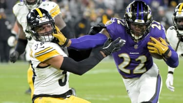 Baltimore Ravens running back Derrick Henry (22) stiff arms Pittsburgh Steelers safety Minkah Fitzpatrick (39)