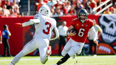 November 30, 2025, Tampa, Florida, USA: Tampa Bay Buccaneers quarterback Baker Mayfield (6) carries the ball, while being chased down by Arizona Cardinals safety Budda Baker (3) during the second quarter at Raymond James Stadium in Tampa on Sunday, Nov. 30, 2025. Tampa USA - ZUMAs70_ 20251130_zan_s70_064 Copyright: xJeffereexWoox