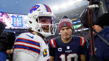 Buffalo Bills quarterback Josh Allen (17) greets New England Patriots quarterback Drake Maye (10)