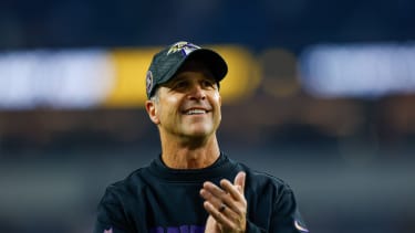 Baltimore Ravens head coach John Harbaugh leaves the football field