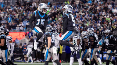 Carolina Panthers quarterback Bryce Young (9) and Carolina Panthers wide receiver Jimmy Horn Jr. (15) celebrate a touchdown.