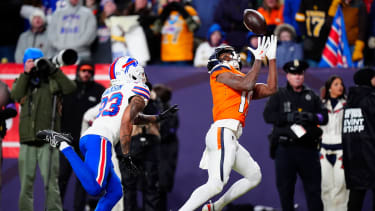 Denver Broncos wide receiver Marvin Mims Jr. (19) catches a touchdown against Buffalo Bills cornerback Dane Jackson (23) during the fourth quarter of an AFC Divisional Round playoff game at Empower Field at Mile High