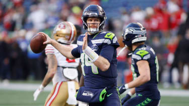Seattle quarterback Sam Darnold (14) throws a 4-yard touchdown pass to wide receiver Jaxon Smith-Njigba against the San Francisco 49 ers during the first quarter of an NFL, American Football Herren, USA Divisional round playoff game at Lumen Field in Seattle, Washington, on Saturday, January 17, 2026. PUBLICATIONxNOTxINxUSA SEA20260117801 GARYxCASKEY