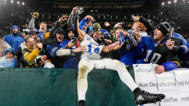 Syndication: Detroit Free Press Detroit Lions wide receiver Amon-Ra St. Brown (14) leaps into Lions fans as they celebrate 24-14 win over Green Bay Packers at Lambeau Field in Green Bay, Wis. on Sunday, Nov. 3, 2024. Detroit , EDITORIAL USE ONLY PUBLICATIONxINxGERxSUIxAUTxONLY Copyright: xJunfuxHanx USATSI_25026095