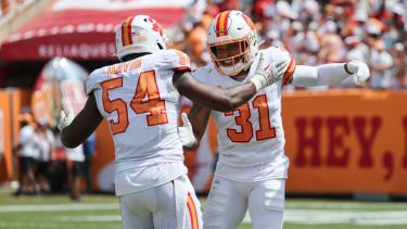Tampa Bay Buccaneers safety Antoine Winfield Jr. (31) is congratulated by outside linebacker Lavonte David (54)