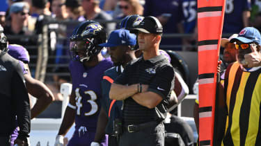 Baltimore Ravens head coach John Harbaugh stands on the sidelines during