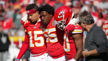 Oct 19, 2025; Kansas City, Missouri, USA; Kansas City Chiefs defensive tackle Omarr Norman-Lott (55) is helped off the field by quarterback Patrick Mahomes (15) and and cornerback Nohl Williams (20) after an injury against the Las Vegas Raiders during the third quarter of the game at GEHA Field at Arrowhead Stadium. Mandatory Credit: Denny Medley-Imagn Images