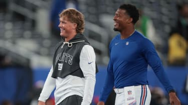 New York Giants quarterback Jaxson Dart, left, and quarterback Jameis Winston, right