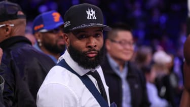 Apr 6, 2025; New York, New York, USA; NFL wide receiver Odell Beckham Jr. sits courtside during the second half of the NBA game between the New York Knicks and the Phoenix Suns at Madison Square Garden. Mandatory Credit: Vincent Carchietta-Imagn Images